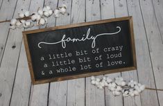 a sign that says, family a little bit of crazy is a little bit of loud and a whole lot of love