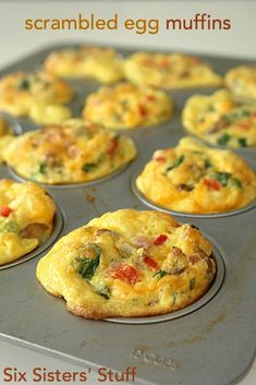 several muffins with different toppings in a pan