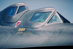 the nose of an air force jet with two small windows on it's side