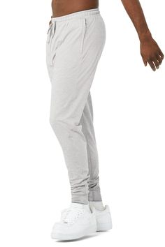 Next-level comfort meets street-smart design. The Revitalize Pant is made from our super-soft Alosoft performance fabric and has an extreme drop rise, on-trend tapered silhouette, pocket at back, elevated seaming and side-zip pockets. Zip pockets Moisture-wicking technology For working out and wearing out Elastic waistband with drawcords Wear-tested by our in-house team for the perfect fit Alo Yoga® | Revitalize Pants in Athletic Heather Grey, Size: Large Alo Yoga Sportswear Bottoms With Go-dry Technology, Alo Yoga Sportswear Bottoms With Go-dry, Alo Yoga Go-dry Sportswear Bottoms, Functional 4-way Stretch Alo Yoga Bottoms, Sporty Alo Yoga Bottoms With Comfort Waistband, Alo Yoga Sporty Bottoms With Comfort Waistband, Versatile Alo Yoga Bottoms, Athleisure Tapered Leg Sweatpants With Hip Pockets, Alo Yoga Relaxed Fit Sports Bottoms