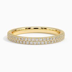 a yellow gold wedding band with rows of diamonds on the inside and outside of it