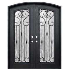 a black double door with wrought iron designs