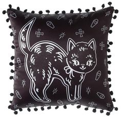 a black and white pillow with a cat on it