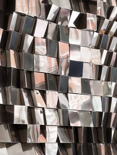 a wall made up of shiny metal squares