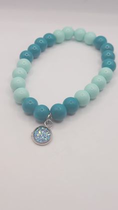 Blue glass beaded bracelet with charm is the perfect accessory for casual or dressy wear. Glass Beads Bracelet Ideas, Glass Bead Bracelet Ideas, Make Clay Beads, Clay Bracelets, Bracelet Inspiration, Glass Beaded Bracelet, Diy Jewelry Unique, Clay Bracelet, Beads Bracelet Design