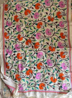 "Multicolored flowers Hand Embroidered Kantha Stitch Silk Dupatta | Semi Tussar Silk Dupatta | Silk Shawls for Weddings | Kantha Dupatta Heavy work full length kantha stitch silk dupatta for parties and weddings All photographs are of original products, exclusive single pieces are available only. LENGTH 2.5 MTR WIDTH 36 INCH PLEASE DRY CLEAN ONLY. SLIGHT DIFFERENCE IN SHADE MIGHT APPEAR DUE TO CAMERA & DAY LIGHTS. PLEASE CHERISH THE LITTLE IMPERFECTIONS, CREATED BY OUR TEAM WITH LOVE\"	in stock Traditional Multicolor Floral Embroidered Dupatta, Traditional Multicolor Floral Embroidery Dupatta, Multicolor Floral Embroidered Fabric For Wedding, Traditional Multicolor Floral Embroidered Fabric, Traditional White Dupatta With Floral Embroidery, Festive Orange Dupatta With Floral Embroidery, Traditional Wear With Floral Embroidery, Multicolor Semi-stitched Floral Embroidered Fabric, Bollywood Style Multicolor Floral Embroidered Fabric