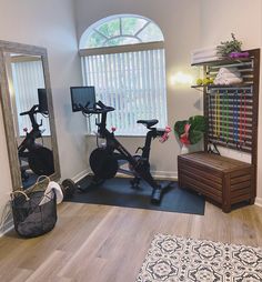 there are two exercise bikes in the room