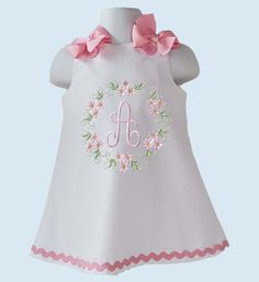 Beautiful A-line/Jumper dress with your little girl Initial or Age embroider. Initial or Age embroider design. Dress is done in a white cotton fabric.  The dress closes in the at shoulder with buttons, bows are pinned at shoulder for an easy removal. Bodice fully lined, we finish all seams with a serger for a professional look and long lasting. All our items are handmade and made to order. If your order needs to be done and ship before my turnaround ( ship date in your order ) please mention date needed in Notes To Seller. We recommend washing inside out on gentle cycle and hang to dry or low heat. Do not use bleach. Iron inside out on low heat. Created in a smoke free studio. If any question please do not hesitate to contact us. Cute Floral Applique Dress For Birthday, Sleeveless Floral Applique Dress For Birthday, Sleeveless Dress With Floral Applique For Birthday, Cute White Dress With Embroidered Hem, Cute Embroidered White Dresses, Cute White Embroidered Dresses, Sleeveless Floral Embroidered Baptism Dress, White Cotton Dress For Birthday, White Cotton Dress With Machine Embroidery