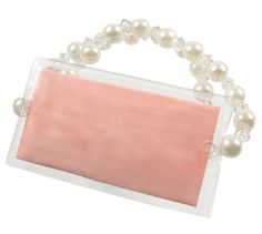 a pink and white purse with pearls on it