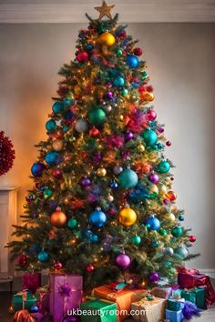 a brightly colored christmas tree with presents under it