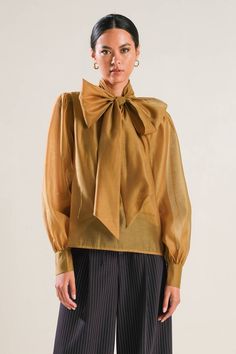 A solid organza top featuring front bow tie, long blouson sleeve with cuff and cami Details: Self : 100% PolyesterLining : 100% Polyester Size & Fit - Model is 5`8" And Wearing Size Small- Measurements Taken From Size Small- Approx. Length: 23.5" Organza Top, Blouson Sleeve, Blouse Jeans, Flying Tomato, Skirt Jumpsuit, Short Jumpsuit, Solid Tops, Swimsuit Cover, Outfit Details