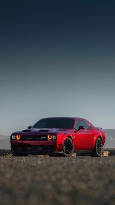 a red sports car parked in the desert