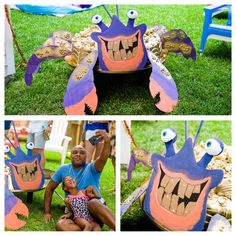 a man and woman sitting on the ground with some paper monsters