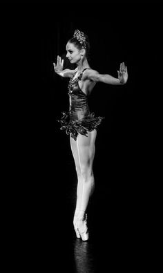 a black and white photo of a ballerina