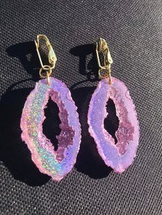 These gold holographic color shifting earrings are absolutely stunning. They are a transparent gold at a certain angle and then as soon as they shift they show a beautiful gold sparkly rainbow. They are lightweight and won't bother your ears compared to regular heavy stone *Last photo is a different color but shows the clip on option Matching necklace available, link below https://www.etsy.com/listing/856577326/holographic-geode-pendant-made-with?ref=listings_manager_grid Please note the color i Iridescent Pierced Drop Earrings, Unique Iridescent Earrings, Party Jewelry With Iridescent Ear Wire, Unique Iridescent Pierced Earrings, Iridescent Party Earrings, Unique Iridescent Earrings For Party, Iridescent Pierced Jewelry For Party, Pierced Iridescent Jewelry For Party, Handmade Iridescent Crystal Earrings For Party