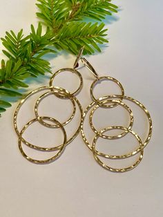 * Gold Interlocking Circle Leverback Earrings, Handmade Hammered 14K Gold fill Multi Hoop Dangle Leverback Earrings, Gift for Her, Birthday, Mothers Day Gift * lightweight, easy to wear interlocking hoop earrings  * 18 gauge 14K Gold fill wire * hand forged, handcrafted earrings  * Ready to ship in 1-4 days More gold earrings here: http://etsy.me/3a1FeKe More interlocking hoops here: http://etsy.me/35DVpvW More sterling silver earrings here: http://etsy.me/3ss3wWv More mixed metal earrings here: http://etsy.me/38Gm8Ks Send me a DM for custom orders! I am happy to create a piece exclusive for you! Simple Silver Earrings, Silver Bar Earrings, Minimalist Earrings Gold, Gold Earrings Wedding, Mixed Metal Earrings, Rectangle Earrings, Gold Filled Hoops, Link Earrings, Hammered Gold