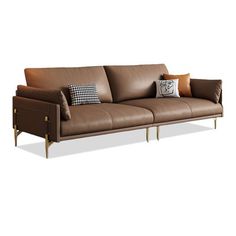 a brown leather couch with two pillows on the armrests and a pillow in front of it