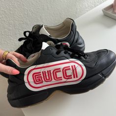 Men's Gucci Rhyton Sega Black And Red Sneakers. Used But Good Condition. Size 10.5. Gucci Rhyton Sneakers Black, Designer Custom Lace-up Sneakers With Logo Print, Designer Logo Print Sneakers With Round Toe, Designer Custom Logo Print Lace-up Sneakers, Gucci Leather Sneakers With Logo, Gucci High-top Logo Sneakers, Gucci High-top Sneakers With Logo, Gucci Sneakers With Logo And Round Toe, Gucci Sneakers With Logo