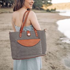 The Quintessence of Grace Immerse yourself in a realm of refined grace with our Grey Everyday CarryAll Tote Bag, exquisitely designed for the modern lifestyle. This grey tote bag stands as a fundamental piece for professionals, educators, and students alike, offering a polished solution for everyday necessities. Features: Sophisticated 2-in-1 Configuration: Versatile design, changeable into four distinct styles Premium Grey Canvas: A blend of strength and environmentally-friendly vegan leather S Elegant Satchel Weekender Bag For Everyday, Elegant Rectangular Weekender Bag With Leather Handles, Elegant Everyday Satchel Weekender Bag, Elegant Weekender Satchel Bag With Removable Pouch, Elegant Weekender Satchel With Removable Pouch, Elegant Weekender Bag With Removable Pouch, Elegant Everyday Laptop Bag With Leather Handles, Elegant Rectangular Weekender Bag With Removable Pouch, Elegant Weekender Bag With Removable Pouch And Double Handle