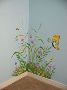 a room with flowers and butterflies painted on the wall next to a carpeted floor