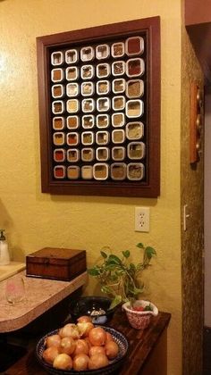 a bowl of onions sitting on top of a wooden table in front of a mirror