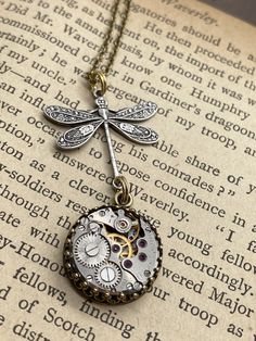 Nadine, Dragonfly Drop Pendant  #artjewelry #victorianjewelry #madhatter #victorianmagpie #uniquejewelry #statementjewelry #handmadejewelry #gothicstyle #steampunkfashion #localartist Elegant Adjustable Dragonfly Jewelry, Elegant Adjustable Dragonfly Necklace, Elegant Dragonfly Jewelry For Jewelry Making, Vintage Handmade Dragonfly Necklace, Handmade Vintage Dragonfly Necklace, Vintage Handmade Dragonfly Jewelry, Bullet Casing Jewelry, Moon Goddess Necklace, Ruby Jewel