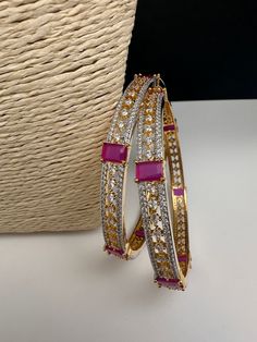 Ameriacan Diamond Ruby Red Bangles. It comes as a Pair (2 Bangles). Premium quality and craftmanship. Satisfaction Guaranteed. Please measure your size before ordering as we don't accept returns. Starting size we have is 2.4. We don't carry size 2.2. Ad Bangles, Traditional Bangles, Ruby Bangles, Red Bangles, Indian Bangles, Diamond Bangles, Beautiful Chokers, Red Stones, Bangles Indian