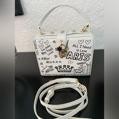 Pop Art White Paris Theme Sam Forever Crossbody Bag With Adjustable And Detachable Strap And Gold Tone Hardware. The Roomy Interior Has An Open Compartment. There Are A Few Smudged Areas ( See Pics) Price Reflects This. This Is One Of A Kind. Nwot White Square Box Bag With Removable Pouch, White Pouch Box Bag With Detachable Handle, White Crossbody Box Bag With Top Carry Handle, White Shoulder Box Bag With Top Carry Handle, White Box Bag With Detachable Handle, White Box Shoulder Bag With Removable Pouch, White Satchel Box Bag With Top Carry Handle, White Crossbody Box Bag With Adjustable Strap, White Top Handle Box Bag With Adjustable Strap