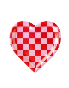 a red and white checkered heart shaped plate