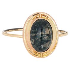 Originally an antique Victorian era stick pin (circa 1880s to 1900s), the moss agate ring is crafted in 14 karat yellow gold. The ring is mounted with the original stick pin. Our jeweler rounded the stick pin into a slim band for the finger. The beautifully detailed ring is set with moss agate measuring 9mm x 7mm. Moss agate is like looking into a small forest with small plumes formed within the stone suggestive of trees or plant life in natural form. Truly unique! The ring is in good condition. We have not cleaned it in order to preserve the patina and collector value. Particulars: Weight: 1.6 grams Stones: The ring is set with moss agate measuring 9mm x 7mm. Size & Measurements: The ring is a size 8 1/2 (sizable). The mount measures 13.5mm in length (0.53 inches) and 11mm wide (0.43 inch Antique Rings Victorian, Vintage Cocktail Rings, Small Forest, Victorian Ring, Vintage Cocktail Ring, Moss Agate Ring, Gold Cocktail Ring, Gold Cocktail, Victorian Rings