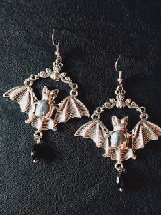 Elvira's Bat Hoop Earrings. Bat Earrings, Silver Earrings, Vintage Bat Jewelry, -Thank you for choosing us. Length - 5 cm. Width - 5 cm. CONDITION: New When placing an order, please write your phone number, this is required by the transport company. Thank you.  ❤︎ Click here to visit my store ❤︎ Dark Beauty:  https://www.etsy.com/shop/DarkBeauty8?ref=seller-platform-mcnav Elegant Metal Earrings For Halloween, Elegant Metal Halloween Earrings, Vintage Halloween Dangle Jewelry, Gothic Pierced Hoop Earrings As Gift, Gothic Hoop Earrings As A Gift, Halloween Metal Drop Earrings, Elegant Adjustable Halloween Earrings, Halloween Dangle Jewelry With Matching Earrings, Halloween Dangle Pierced Earrings