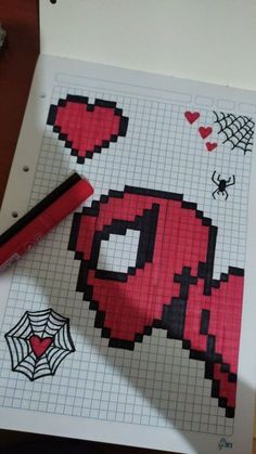 a cross stitch pattern with a spiderman drawn on it and a crayon marker