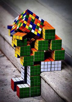 the colorful cubes are stacked on top of each other in order to make it look like an elephant