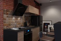 a kitchen with brick walls and black appliances