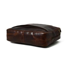 Experience sophistication with our glossy reddish brown leather briefcase. Perfectly sized for laptops and work essentials, this unique accessory makes a stylish statement in any setting, from the boardroom to the classroom. Its distinctive reddish-brown color sets it apart, making a stylish and memorable impression wherever you take it. The elegant reddish brown leather briefcase is the perfect stylish work companion. This briefcase isn't just functional; it's a statement piece that reflects yo Modern Brown Satchel For Formal Occasions, Modern Brown Formal Satchel, Rectangular Vintage Brown Shoulder Bag For Office, Vintage Brown Rectangular Shoulder Bag For Office, Burgundy Rectangular Satchel For Business, Classic Burgundy Rectangular Satchel, Brown Smooth Grain Briefcase For Office, Brown Smooth Grain Laptop Bag For Business Trips, Brown Smooth Grain Laptop Bag For Office