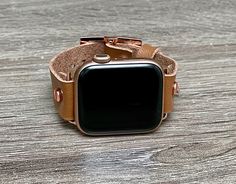 High Quality Light Brown Color Vegan Leather Strap Bracelet. 18mm Watch Strap with Adjustable Buckles. Gorgeous Design Bracelet Tailored to Perfection. Designed And Handmade by Simeon D Jewelry Studio. This Bracelet Fits ALL Apple Watch Series. Please Measure Your Wrist Before Submitting Your Order! Not For Other Models. Apple Watch Is NOT Included. Ultra Fiber Vegan Leather: -Moisture-Wicking and Heat-Dispensing -Water-Washable -Breathable -Lightweight Let's be Friends! Follow my Studio on Soci Classic Adjustable Apple Watch Band As Gift, Classic Adjustable Gold Apple Watch Band, Adjustable Gold Apple Watch Band For Everyday, Gold Watch Accessories With Wrist Strap For Everyday Use, Classic Adjustable Rectangular Apple Watch Band, Adjustable Gold Apple Watch Band With Wrist Strap, Gold Apple Watch Band For Everyday Use, Everyday Rectangular Bracelet Watch Band, Adjustable Gold Watch Band For Everyday Use