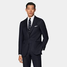 This navy perennial suit pairs a tailored fit jacket with a natural shoulder with slim fit, straight-leg trousers featuring a flat front and belt loops. Classic Fitted Pantsuit For Business Meetings, Navy Suits With Welt Pockets And Lapel Collar, Timeless Navy Suits For Work, Timeless Navy Suit For Work, Navy Long Sleeve Suit For Formal Occasions, Navy Tailored Double Breasted Suit For Business Casual, Navy Long Sleeve Suits With Pressed Crease, Navy Long Sleeve Suits For Formal Occasions, Timeless Navy Business Suit