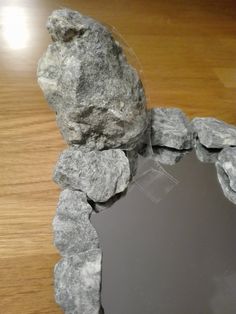 there is a piece of rock that has been broken in half on the table top