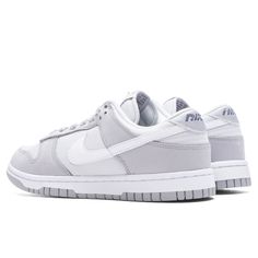 The Nike Women’s Dunk Low LX NBHD takes a monochromatic approach for the upcoming season with the new colorway 'Light Smoke Grey.' Composed of canvas at the upper, the design features contrasting leather overlays. The tumbled leather Swoosh and heel tab as well as the speckled outsole follow suit in tone, while the textile base contrasts in the same grey shade as the adjacent midsole and tongue. Branding elements see a new aesthetic with a 3D swoosh at the tongue and embroidery reading ‘Nike’ at Pretty Sneakers, Grey Nikes, Grey Shoes, Shoe Inspiration, Nike Shoes Women