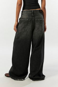 Statement BDG jeans in a column silhouette. Designed with an ultra-wide leg in a low-rise that sits at the hips and raw hems that skim the floor for an edgier vibe. Exclusively at Urban Outfitters. Features BDG Anika ultra-wide leg column jeans Low rise baggy jeans Lightweight soft denim Low rise waist 5 pocket styling Full length Raw hems UO exclusive Content + Care 42% Cotton, 20% recycled cotton, 38% Tencel Machine wash Imported Size + Fit Low rise Ultra-wide column leg Full length Model in B Low Low Rise Jeans, Dream Clothes Pants, Lowrise Baggy Jeans, Cute Baggy Outfits, Baggy Black Jeans Outfit, Ultra Baggy Jeans, Low Waist Baggy Jeans, Black Jeans Baggy, Baggy Jeans Low Rise