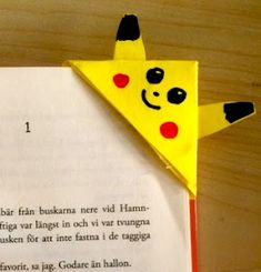 an origami pikachu is on top of a piece of paper that reads i love you