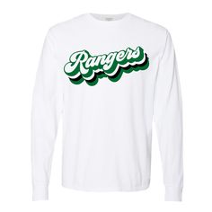 🔥 This long sleeve shirt features a "groovy" retro font with the word "Rangers."  Show off your Iberia Ranger Pride with this shirt!  Shirt: White Ink: Kelly Green and Black  100% ring spun cotton, garment-dyed 🔥 *--*--*--*--*--*--*--*--*--*--*--*--*--*--*--*--*--* Other Campfire Ink Shirts You Might Love ❤️ https://www.etsy.com/listing/690623634/wild-ride-octopus-on-a-unicycle-shirt https://www.etsy.com/listing/632840304/daydreams-airstream-shirt-camper-tshirt https://www.etsy.com/listing/704468037/bee-kind-shirt-yellow-be-kind-tshirt *--*--*--*--*--*--*--*--*--*--*--*--*--*--*--*--*--* 🔥Contact me with any questions: https://www.etsy.com/messages/new?from_action=contact-seller&recipient_id=7228465&referring_id=647618133&referring_type=listing&with_id=7228465 *--*--*--*--*--*--*--*--*- Casual White Fan Gear Shirt, White Cotton Shirt With Lettering, White Fan Apparel Tops With Lettering, White Fan Merchandise Tops With Lettering, White Tops With Lettering For Fan Merchandise, White Shirt With Screen Print For Fan Gear, White Fan Apparel T-shirt With Lettering, White Shirt With School Spirit For Spring, White Fan Gear Shirt With Screen Print