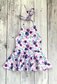 Girls purple peach floral halter summer dress Please allow 3-5 business days for your item to be made and shipped. All items are shipped by USPS First class mail. Each item is handmade in a smoke free, pet free home. If you need something custom made, please send me a message. Pink Fitted Tie-back Sundress, Fitted Pink Sundress With Tie Back, Pink Fitted Sundress With Tie Back, Cute Printed Summer Sundress, Fitted Floral Print Halter Dress For Garden Party, Pink Tie-back Halter Dress For Summer, Pink Fitted Printed Sundress, Pink Printed Fitted Sundress, Pink Summer Halter Dress For Garden Party