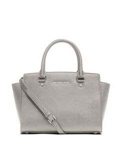 Get a handle on timeless classic style with the Medium Selma Saffiano leather satchel. Offering up a smart modern shape and subtle logo detailing, it strikes a high-fashion chord, while promising a smart sensibility day or night. Saffiano LeatherZip Top Top Handle: 4.5" Adjustable Strap: 17.5-19.5" Interior: One Inside Zip Pocket, Two Open Inside Pockets Size: 13 X 8 X 4" Color: Pearl Grey Sac Michael Kors, Outlet Michael Kors, Michael Kors Selma Medium, Cheap Michael Kors Bags, Pearl Gray, Mk Handbags, Michael Kors Satchel, Michael Kors Selma, Cheap Michael Kors