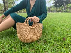 100% handmade from water hyacinth  Ideas :  Handles bag for everyday use/special occasion Can wear both casual or formal/smart casual❤️ Multifunction design. ❤️❤️Handmade by professional weaver from Phayao north of Thailand  Width. Bottoms 7  inches, Tops 11 inches Length :  7 inches Thick    :  Bottoms 3.5  inches, Tops 2.5 inches Handle : 4.5 inches Sturdy and multifunction Can use pompom or keyring to makes it unique to your own style Durable & Light weight Cleaning ❤️❤️❤️❤️ Uses Damp Cloth to clean both inside and outside. Let it dry and adjust the shape. Casual Brown Straw Bag For Picnic, Casual Natural Fiber Bag For Picnic, Casual Shoulder Bag For Picnic And Beach Season, Casual Green Bag For Picnics, Casual Green Bag For Picnic, Eco-friendly Beach Bag For Spring Picnic, Casual Handwoven Picnic Bag, Handmade Bags For Beach Picnics, Handmade Shoulder Bag For Spring Picnic