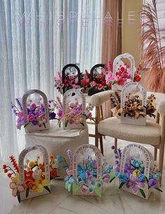 the chairs are decorated with colorful flowers and signs for each individual to put on them