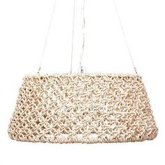 a crocheted purse hanging from a chain