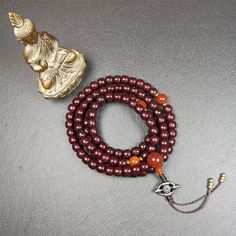 ❤This mala is made by Tibetan craftsmen and come from Hepo Town, Baiyu County,Tibet, the birthplace of the famous Tibetan handicrafts.It's composed of 108 pcs 9mm lotus seed beads,with agate spacer beads,and agate bead counters,diameter 0.35",circumference 35".❤Details:Mala'perimeter is 88cm,35 inches.108 lutus seed beads approximately 9mm / 0.35 inch.1 × agate main bead,diameter 12mm × 10mm / 0.47 × 0.4 inch.2 × agate spacer beads diameter 10mm / 0.4 inch.1 × agate guru bead,22mm × 13mm / 0.87 Traditional Wooden Beaded Bracelets For Meditation, Spiritual Mala With 8mm Beads, Spiritual Beaded Bracelets For Rituals, Bohemian Mala With 108 Round Beads, Bohemian 108 Beads Round Mala, Bohemian Mala With 108 Beads, Traditional Jewelry For Meditation With 8mm Beads, Traditional Handmade Mala For Meditation, Traditional 8mm Beads Jewelry For Meditation