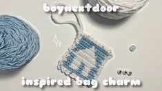 two balls of yarn next to each other with the words, boynet door inspired bag charm