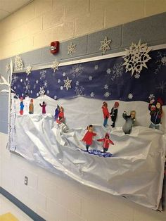 a bulletin board is covered in snow and children are playing on the sleigh